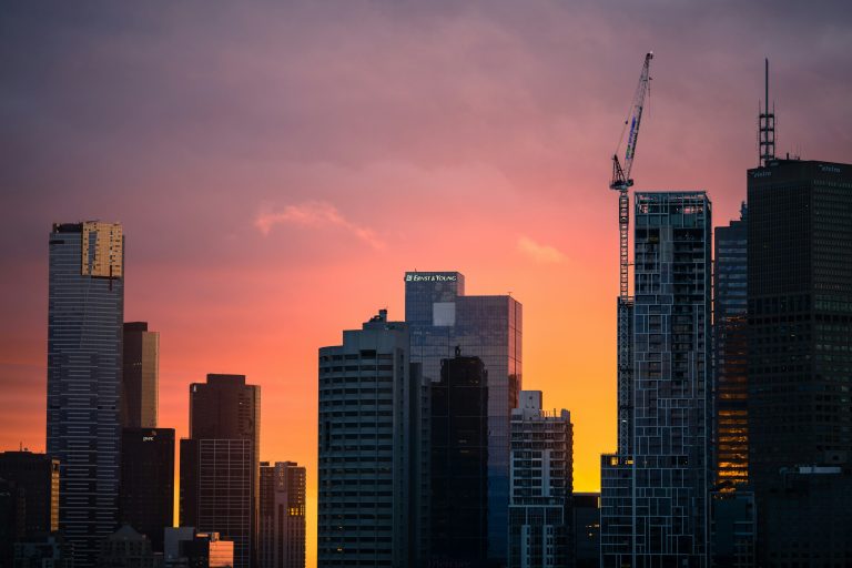 City skyline at sunset representing building meaningful businesses and long-term impact