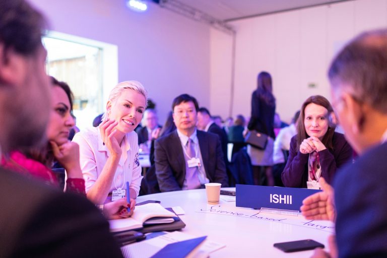Professionals in conversation representing relationships, trust and opportunity