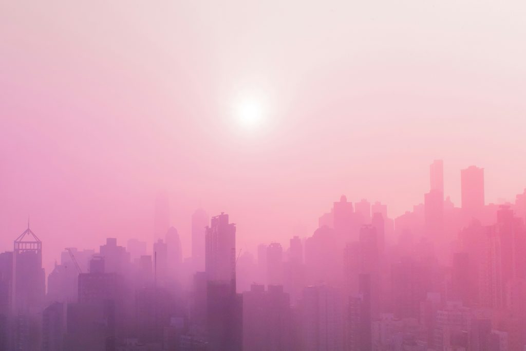 City horizon emerging through mist representing a future-focused vision