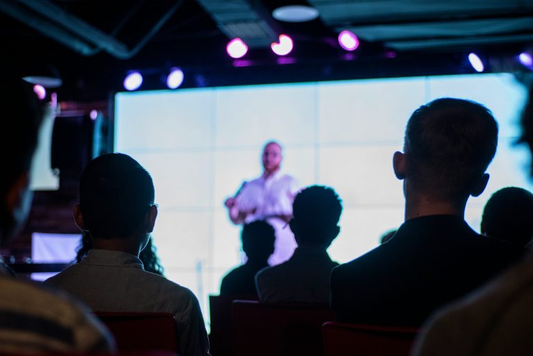 Audience watching a speaker at a live event